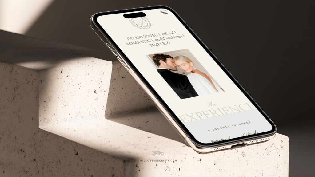Smartphone displaying a mobile Showit website with luxury wedding photography branding—illustrating how a refined, strategic Showit template helps photographers attract and book premium clients.